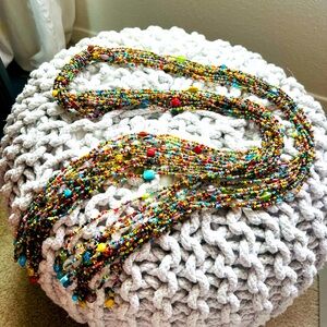 Beaded multi-color wrap necklace by Anthropologie. Total length is 54”.
